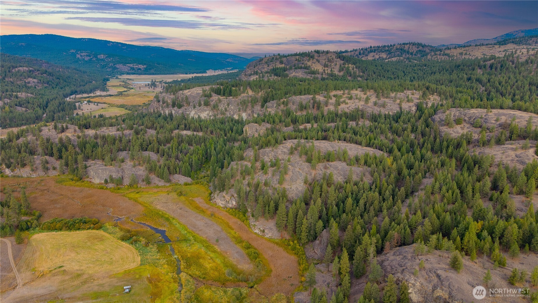 0 Eaglestone Road Tonasket, WA 98855 - Photo 37 of 40 a view of a lake with a mountain