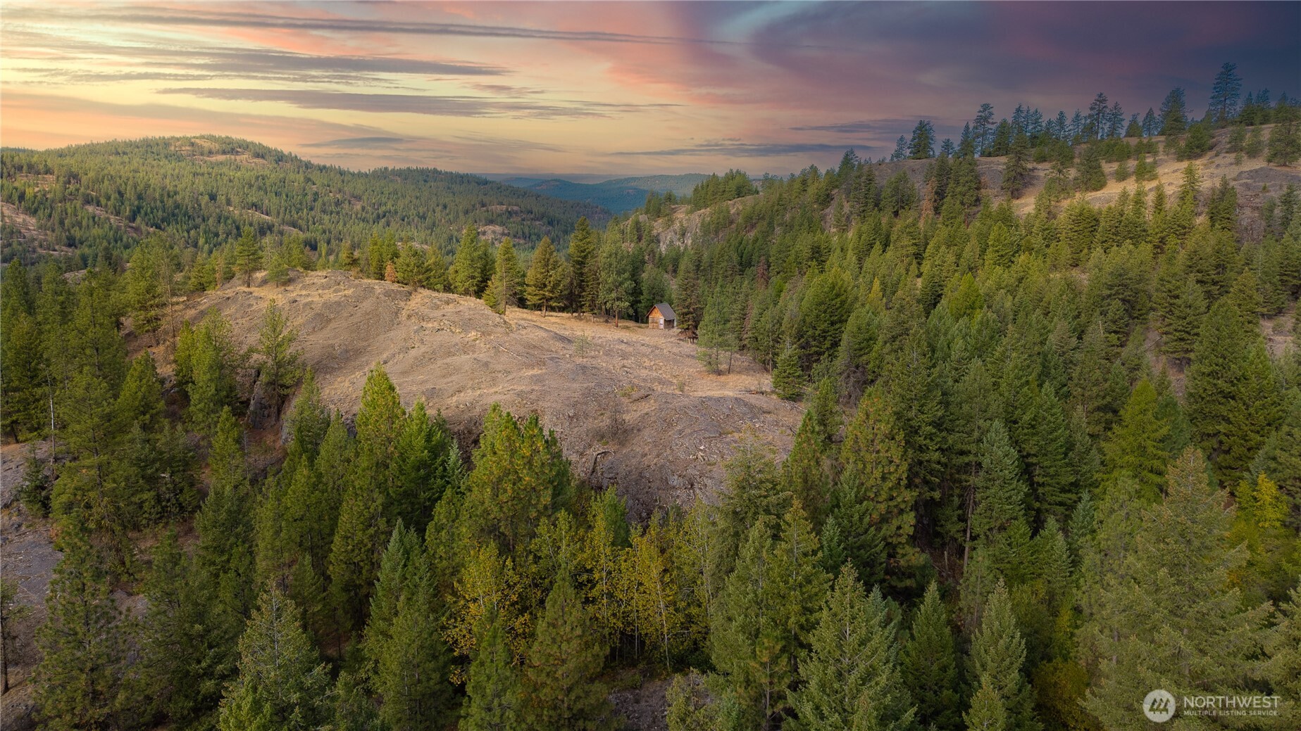0 Eaglestone Road Tonasket, WA 98855 - Photo 8 of 40 a view of a lake with a mountain in the background