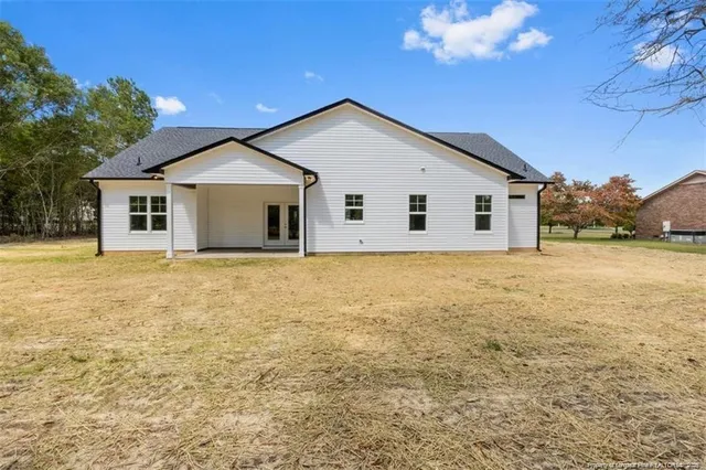 a view of a house with a yard