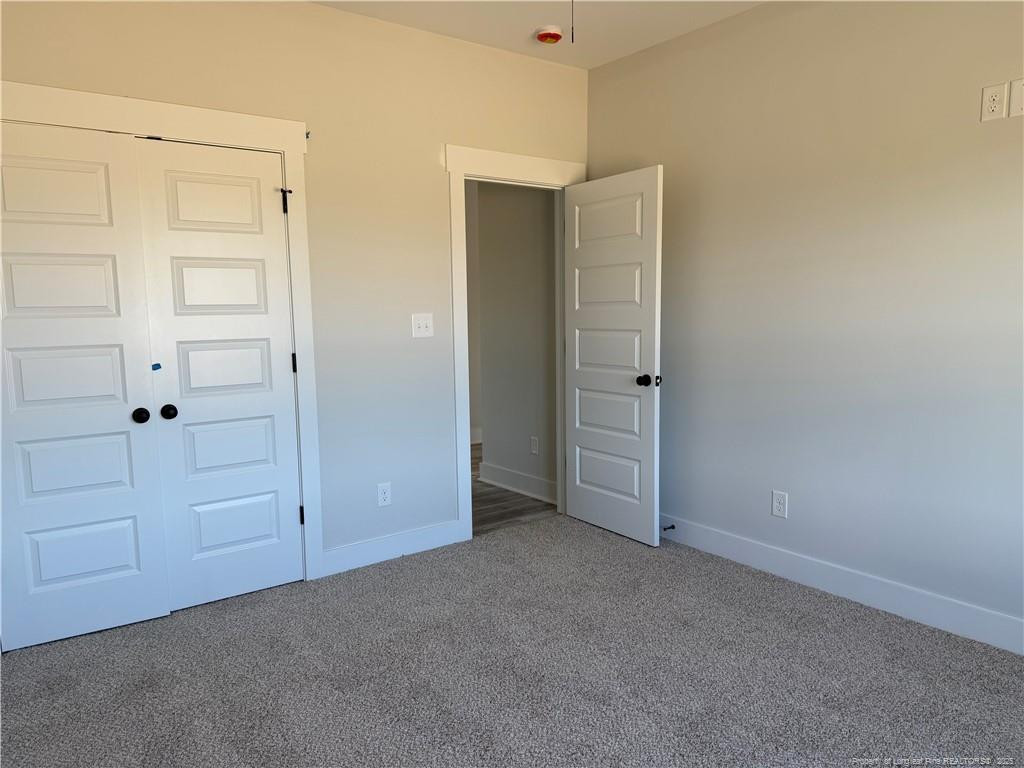 7166 Chicken Foot Road Hope Mills, NC 28348 - Photo 7 of 13 an empty room with closet area