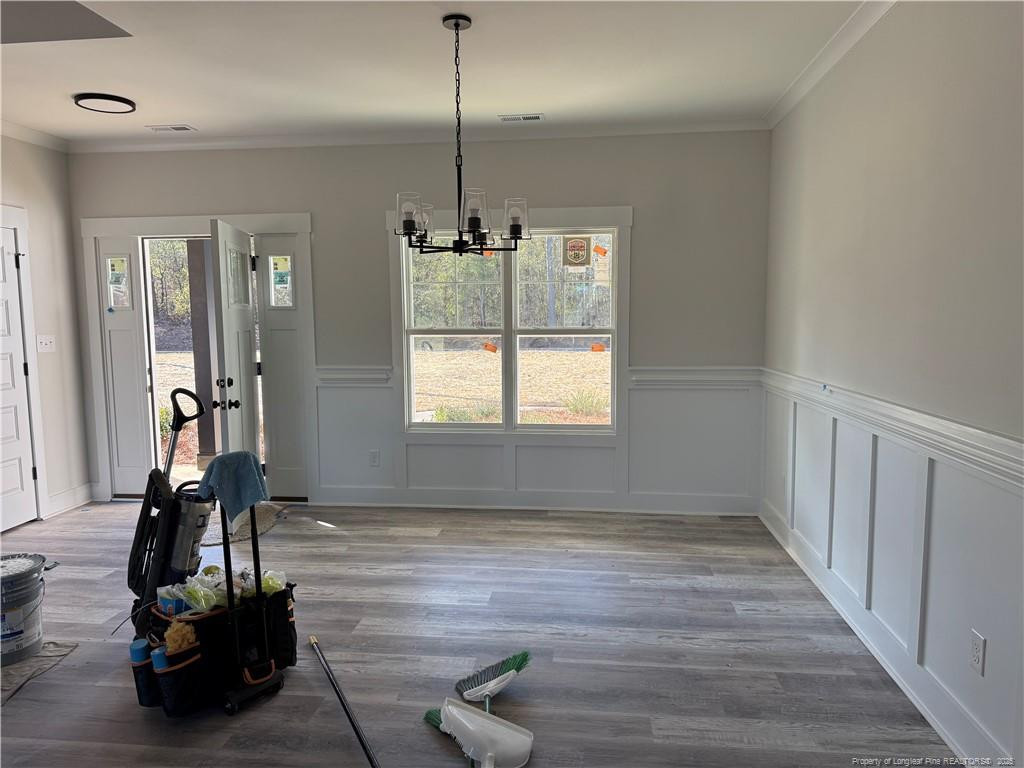 7166 Chicken Foot Road Hope Mills, NC 28348 - Photo 9 of 13 a view of a room with gym equipment