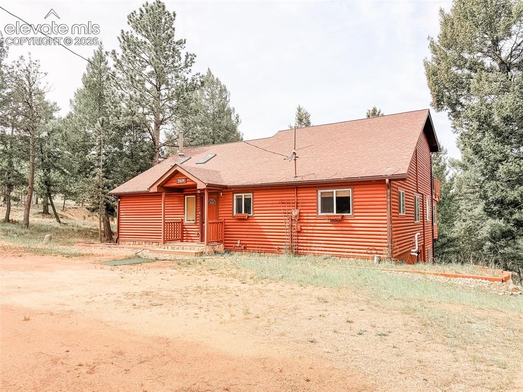 269 Southpark Road Florissant, CO 80816 - Photo 1 of 38 a front view of a house with a yard