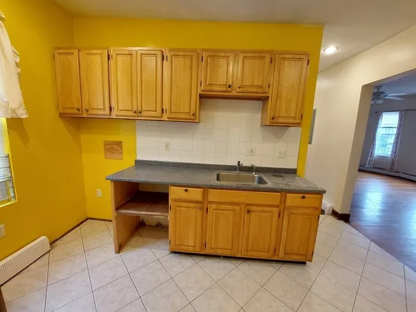 a kitchen with stainless steel appliances a sink and cabinets