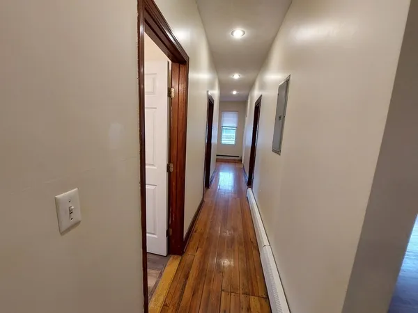 a view of gallery with wooden floor