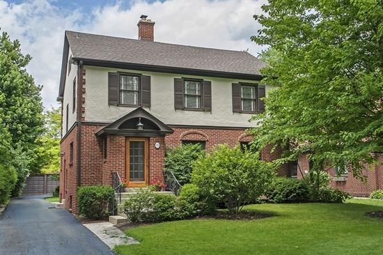 393 Sunset Road Winnetka, IL 60093 - Photo 1 of 15 a front view of a house with a yard