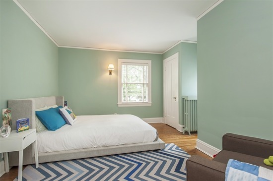 393 Sunset Road Winnetka, IL 60093 - Photo 11 of 15 a bedroom with a bed and wooden floor