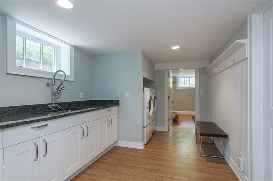 393 Sunset Road Winnetka, IL 60093 - Photo 12 of 15 a hallway with sink and mirror