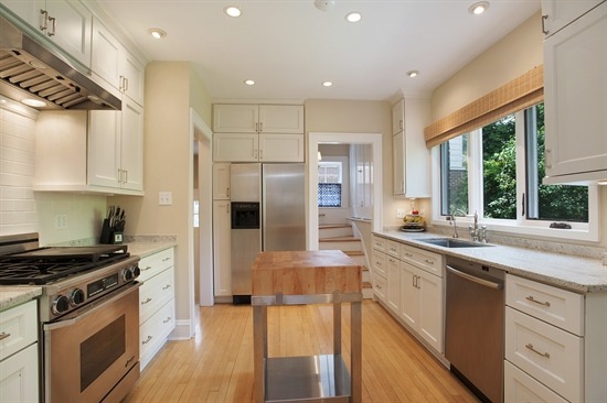 393 Sunset Road Winnetka, IL 60093 - Photo 5 of 15 a kitchen with stainless steel appliances kitchen island granite countertop a stove a sink and a refrigerator