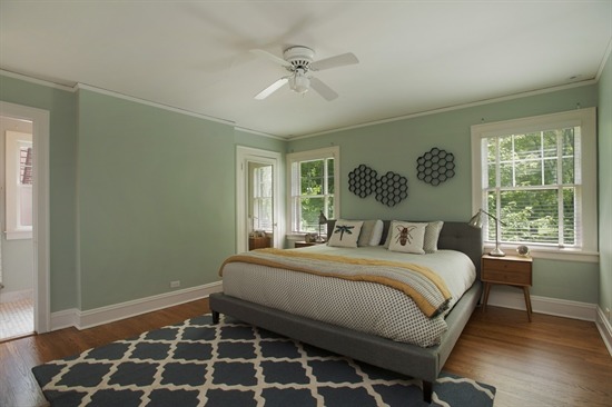 393 Sunset Road Winnetka, IL 60093 - Photo 8 of 15 a bedroom with a large bed and a window