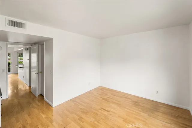a bedroom with a bed and flat screen tv
