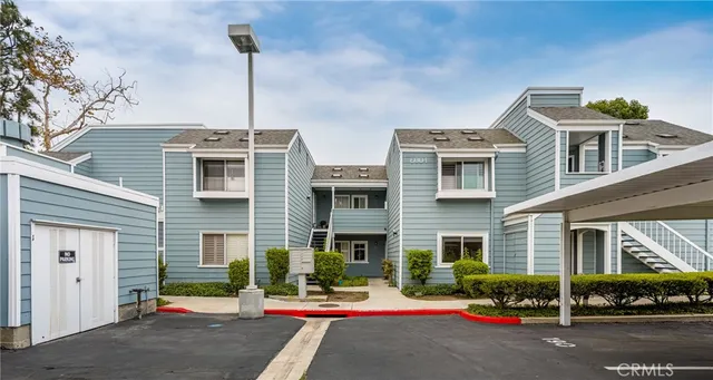 a view of house with wooden fence