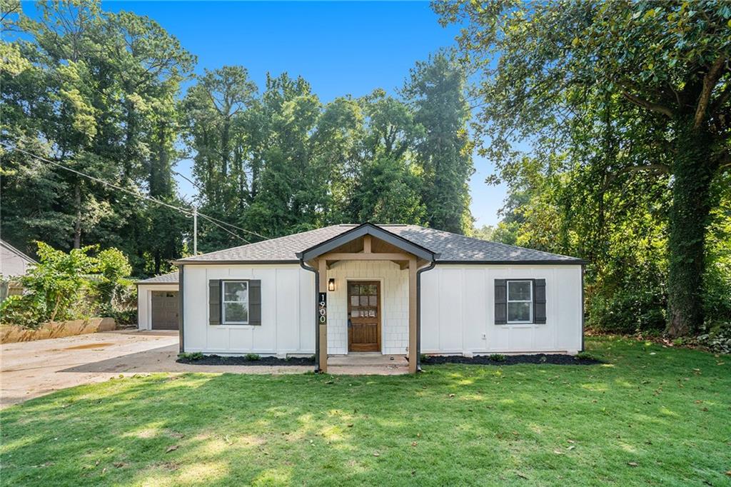 1900 Brannen Road Southeast Atlanta, GA 30316 - Photo 1 of 1 a front view of a house with a garden
