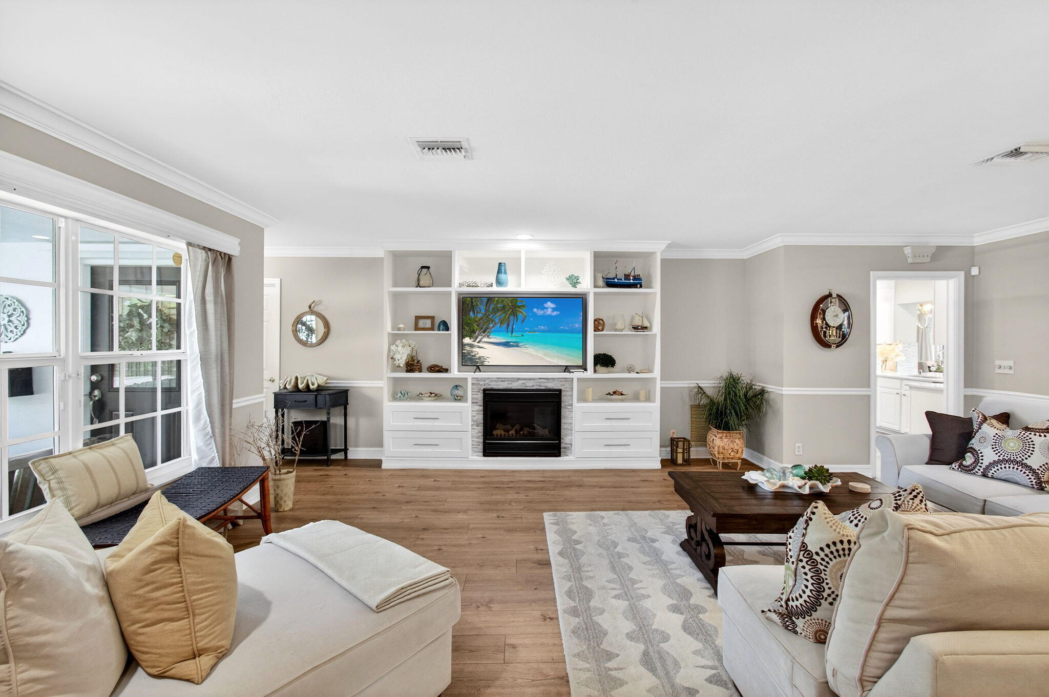 780 Elm Tree Lane Boca Raton, FL 33486 - Photo 19 of 96 a living room with furniture flat screen tv and a fireplace