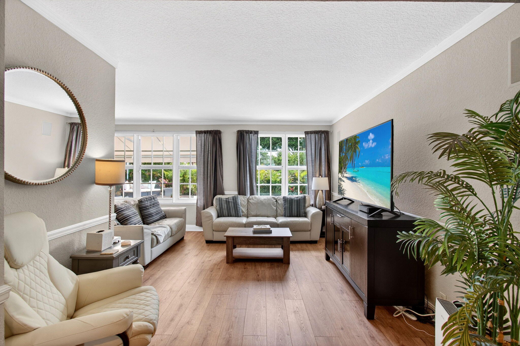 780 Elm Tree Lane Boca Raton, FL 33486 - Photo 26 of 96 a living room with furniture and a large window