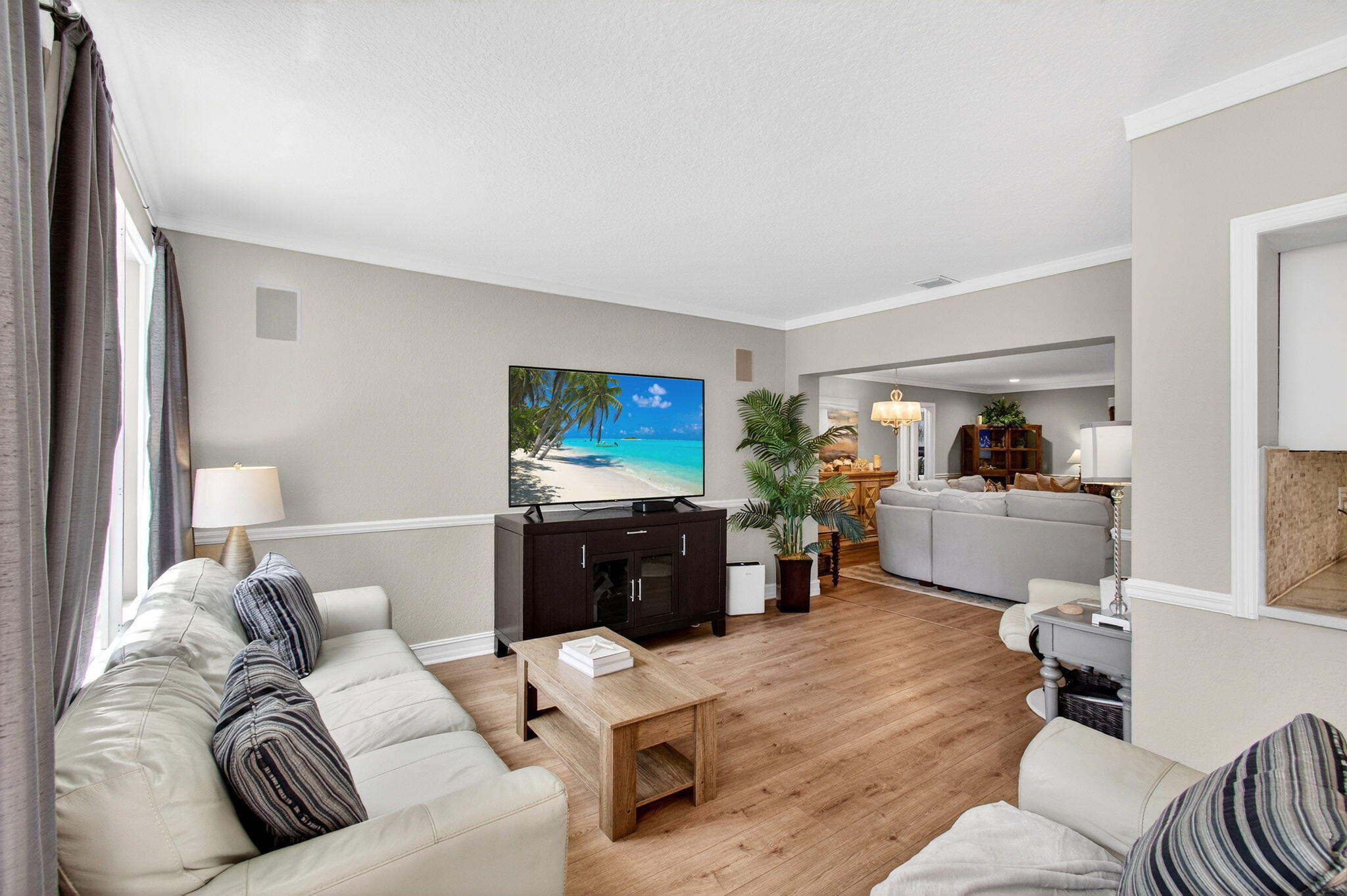 780 Elm Tree Lane Boca Raton, FL 33486 - Photo 28 of 96 a living room with furniture and a flat screen tv