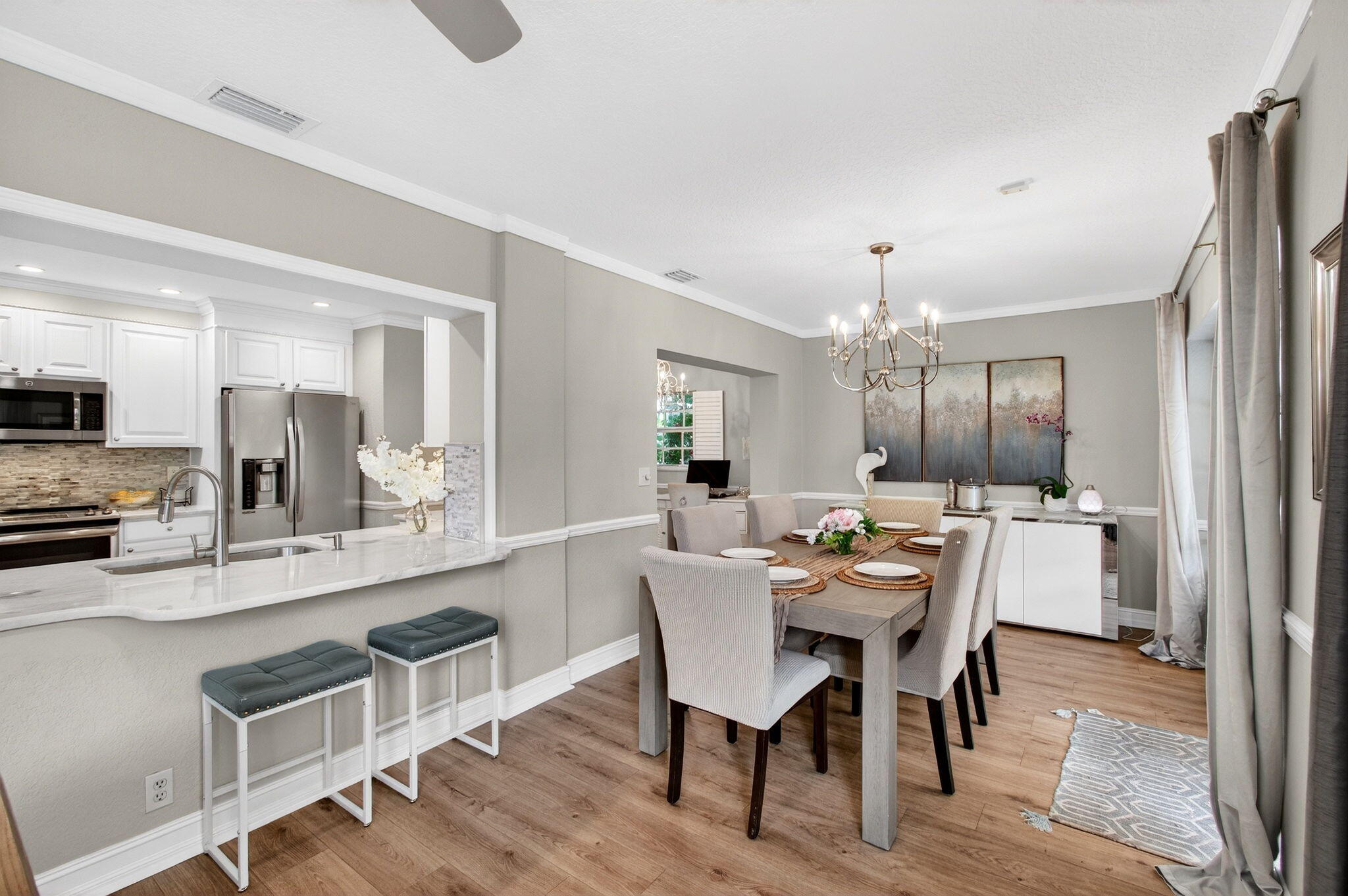 780 Elm Tree Lane Boca Raton, FL 33486 - Photo 31 of 96 a dining room with furniture a chandelier and wooden floor