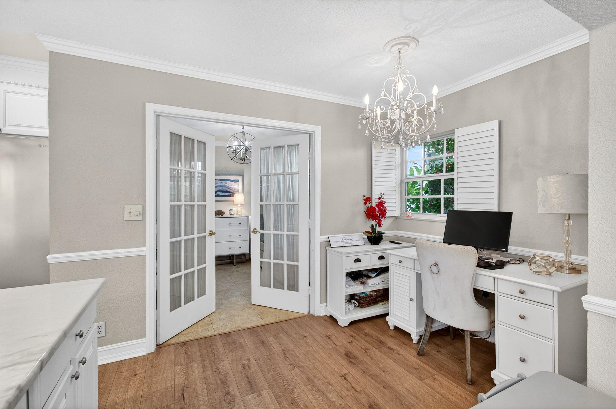 780 Elm Tree Lane Boca Raton, FL 33486 - Photo 36 of 96 a workspace with furniture a chandelier a rug and a window