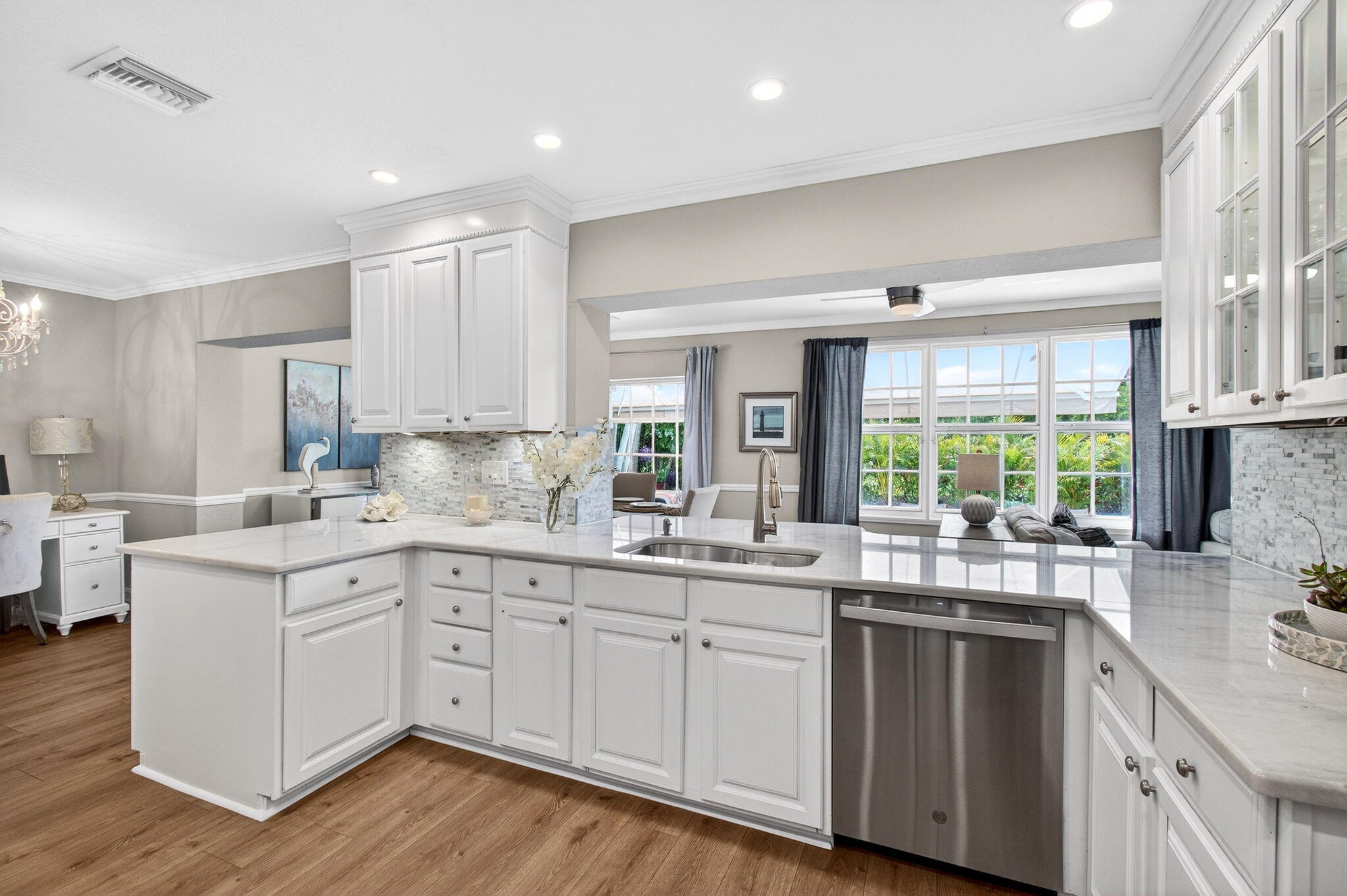 780 Elm Tree Lane Boca Raton, FL 33486 - Photo 44 of 96 a kitchen with a sink stove and cabinets