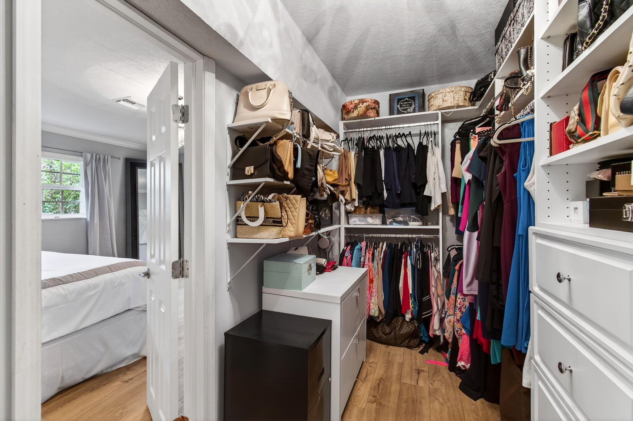 780 Elm Tree Lane Boca Raton, FL 33486 - Photo 60 of 96 a view of walk in closet with clothes and shoes