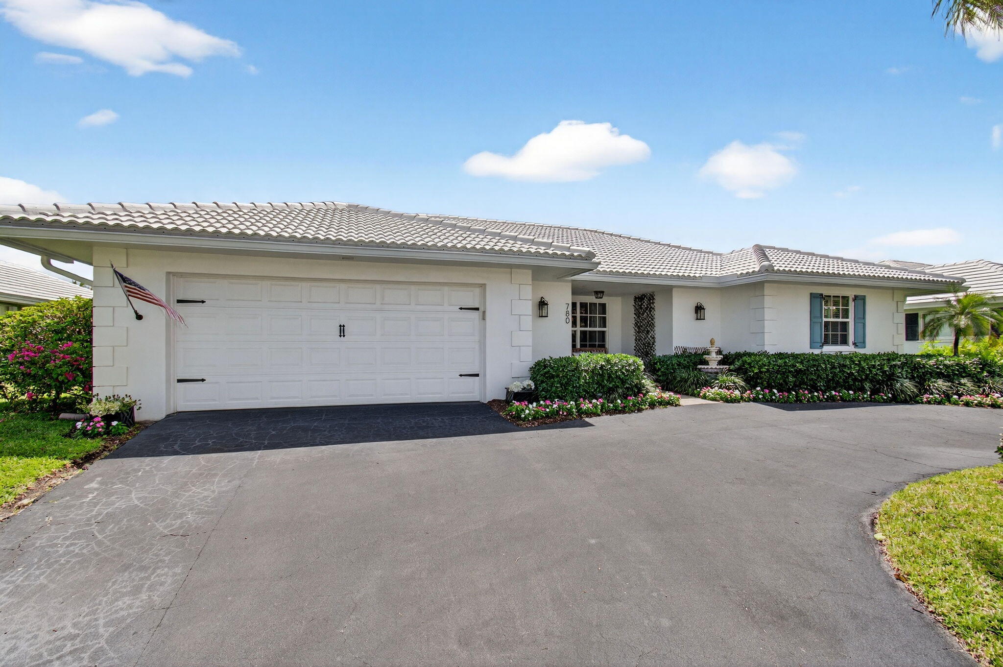 780 Elm Tree Lane Boca Raton, FL 33486 - Photo 8 of 96 a view of a house with a yard and garage