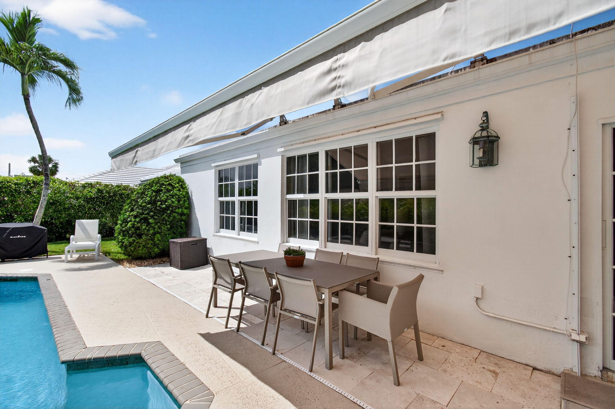 780 Elm Tree Lane Boca Raton, FL 33486 - Photo 81 of 96 a view of a patio with table and chairs with wooden floor and fence