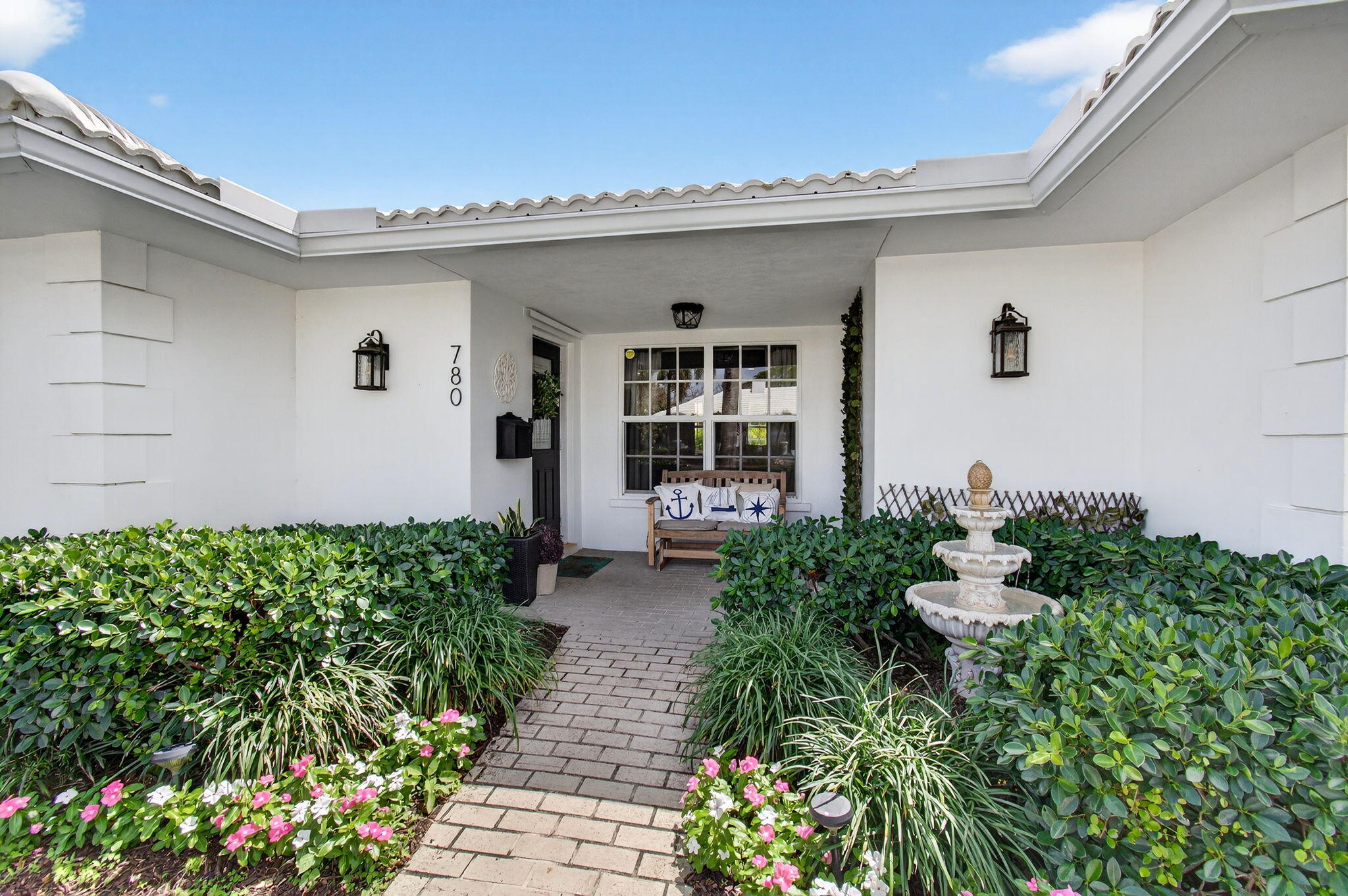 780 Elm Tree Lane Boca Raton, FL 33486 - Photo 10 of 96 a front view of a house with a yard