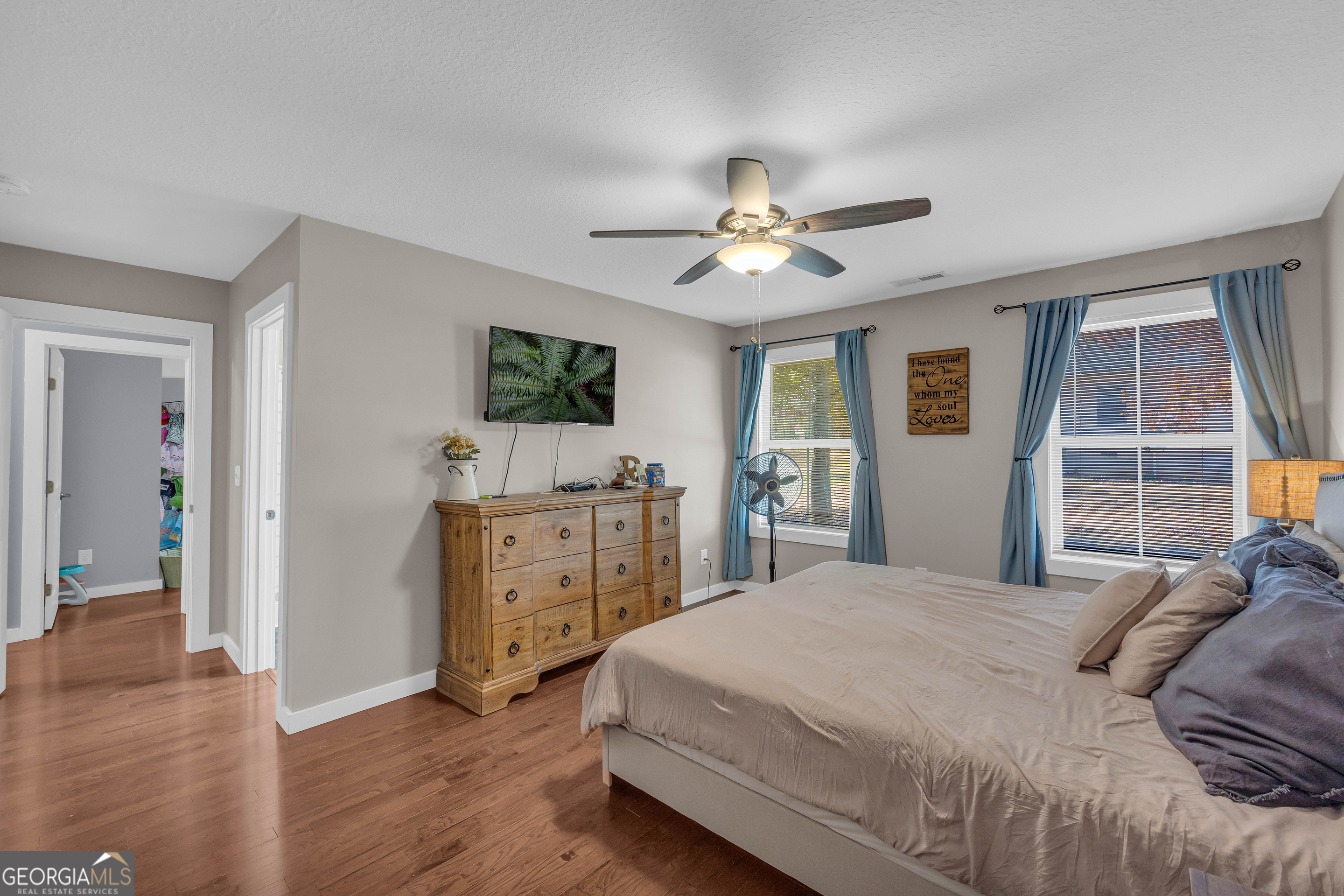323 North Point Circle Hartwell, GA 30643 - Photo 28 of 42 a spacious bedroom with a bed and a flat screen tv