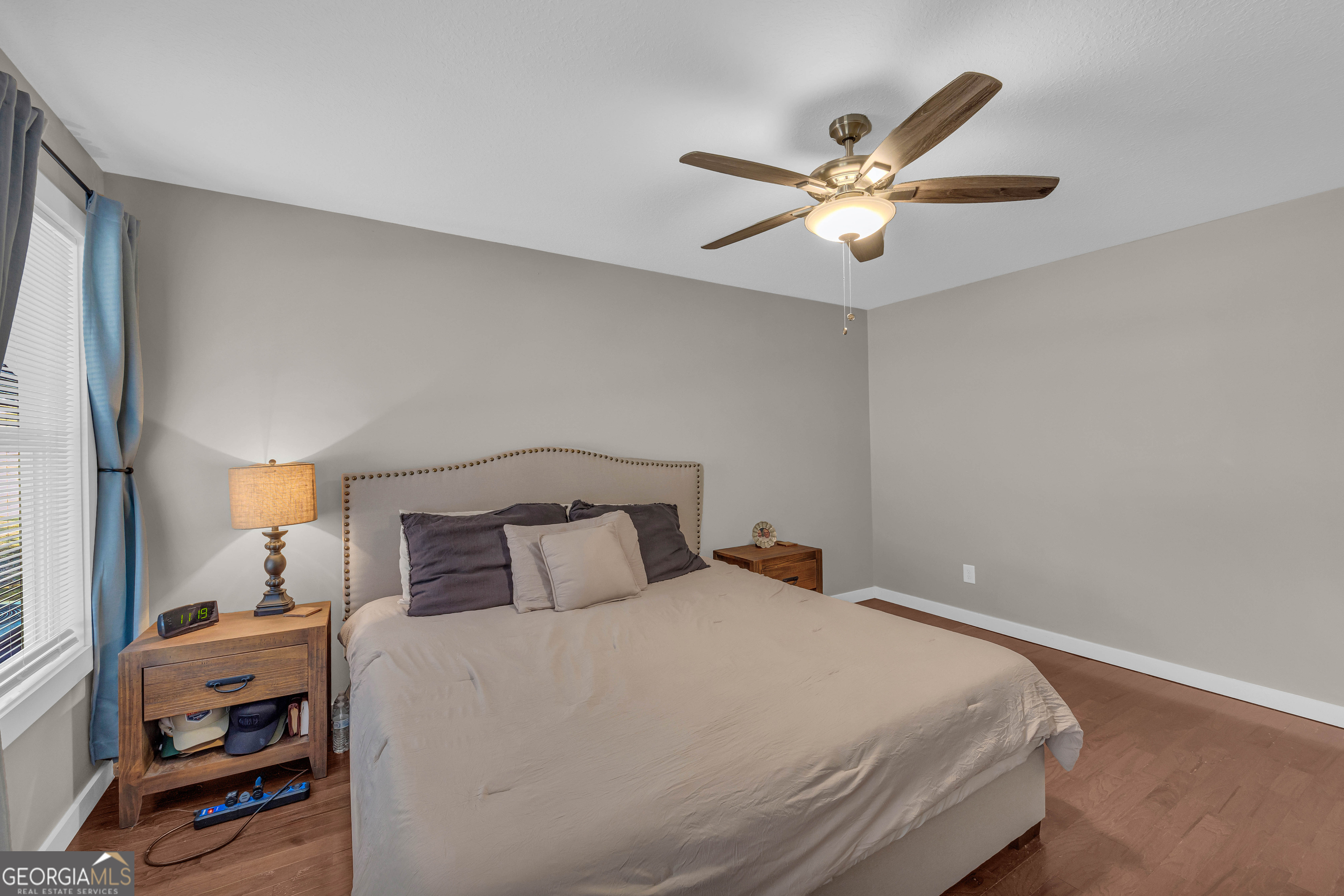 323 North Point Circle Hartwell, GA 30643 - Photo 30 of 42 a bedroom with a bed and a chandelier