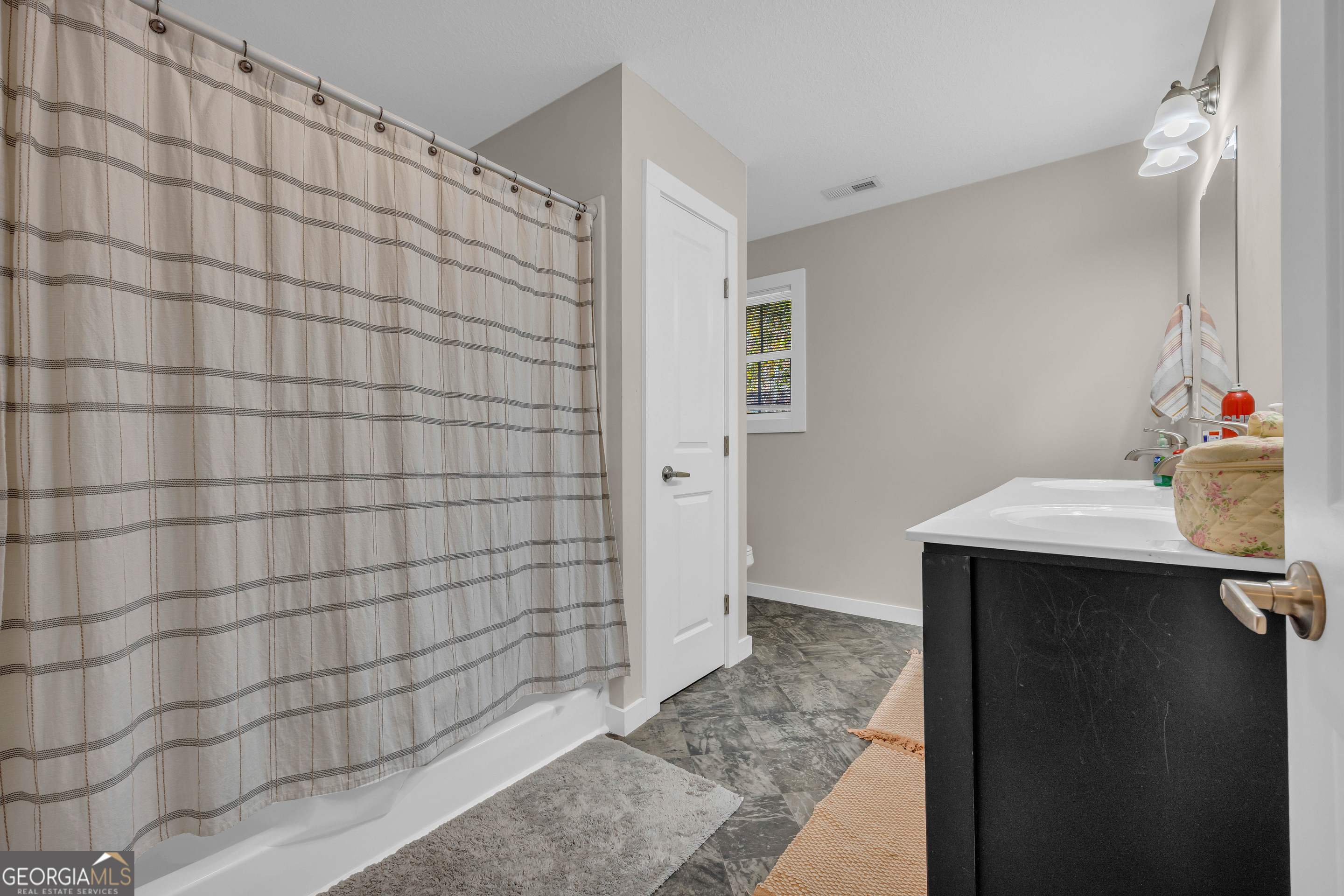 323 North Point Circle Hartwell, GA 30643 - Photo 32 of 42 a bathroom with a sink and shower
