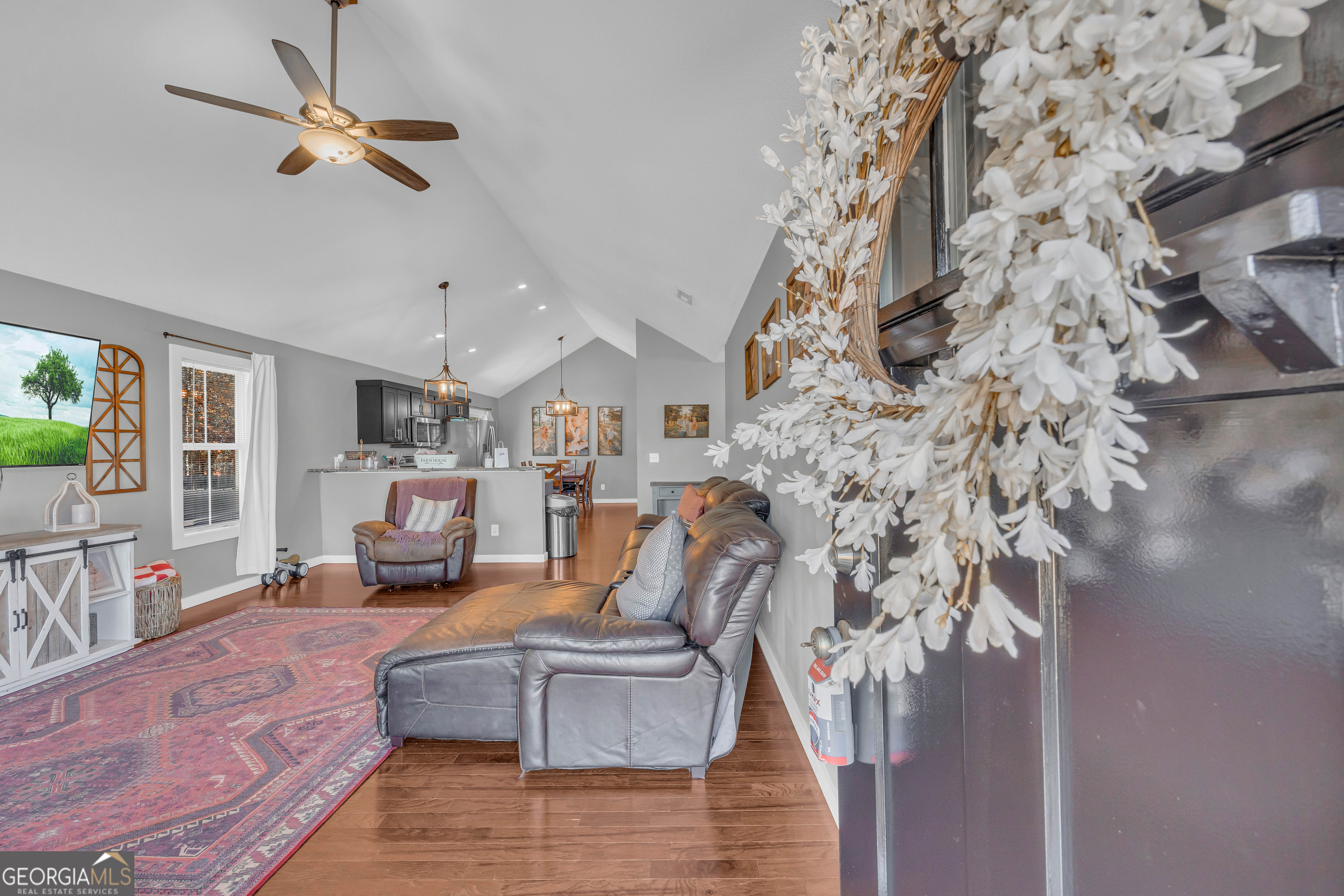 323 North Point Circle Hartwell, GA 30643 - Photo 8 of 42 a living room with furniture and a chandelier