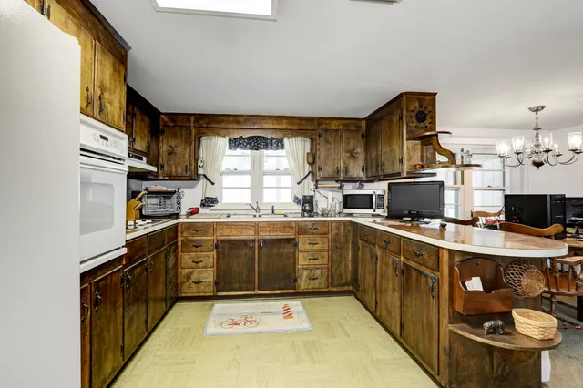 a kitchen with stainless steel appliances a sink and a stove