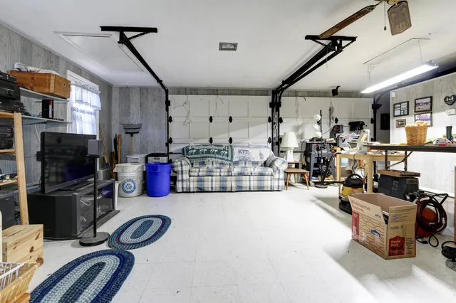a living room with lots of furniture and a flat screen tv