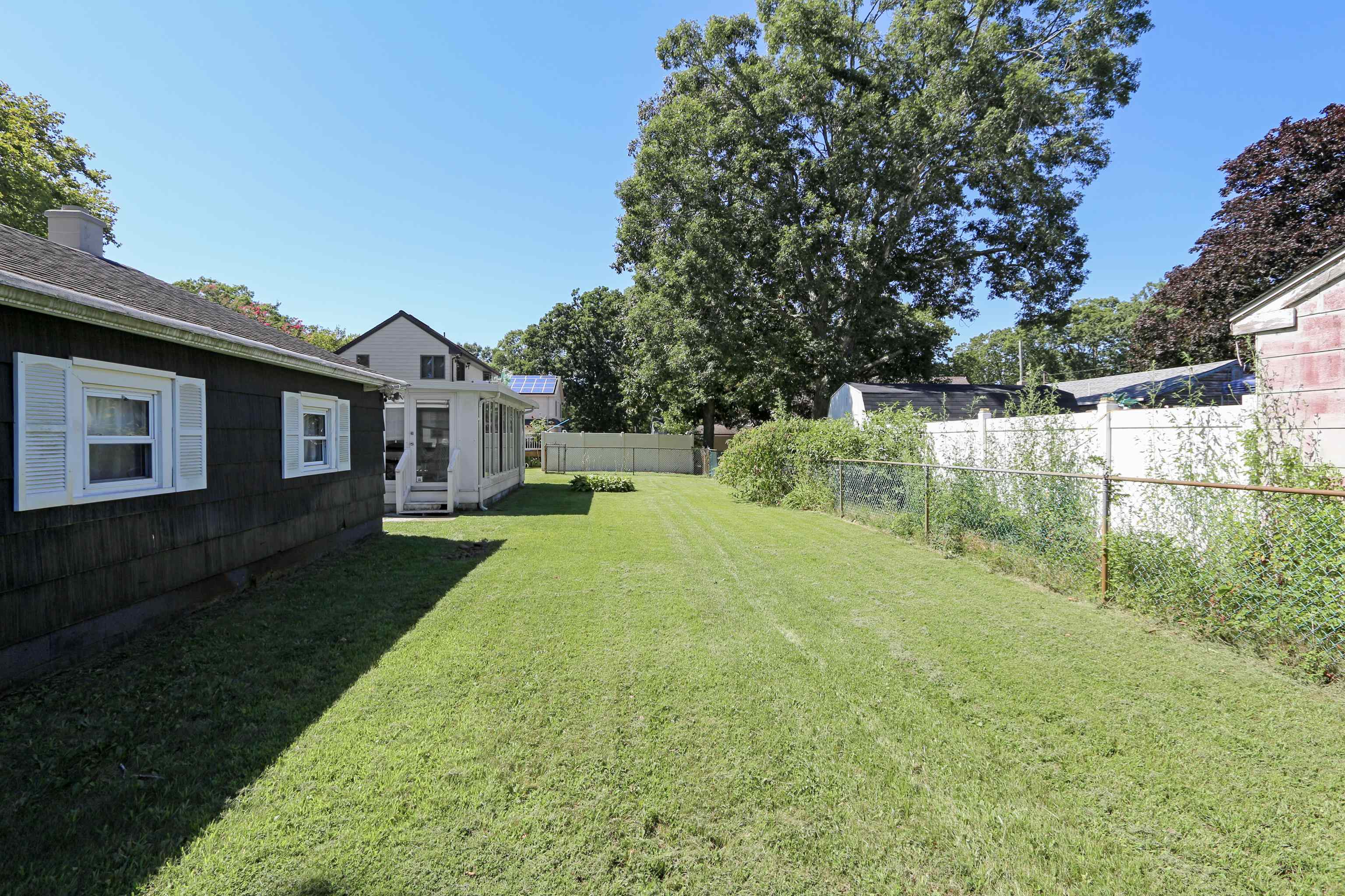 12 West Cedar Avenue Rio Grande, NJ 08242 - Photo 33 of 40 a view of backyard of house with green space