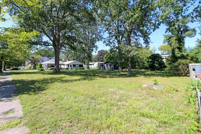 a view of a swimming pool with a yard
