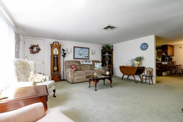 a living room with furniture and a table