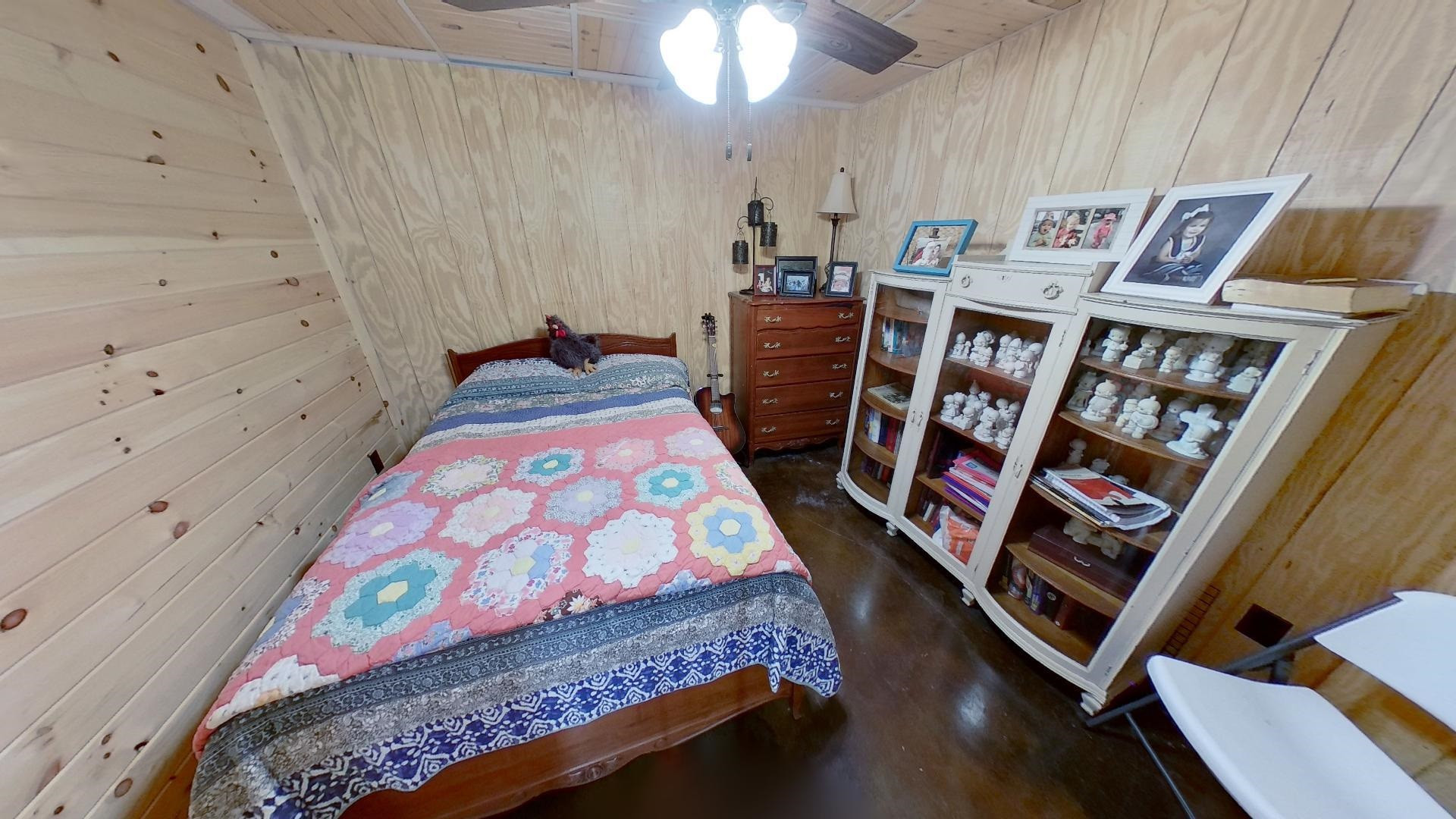 2591 Rue Hammer Road Cedar Grove, TN 38321 - Photo 13 of 27 a bed sitting in a bedroom next to a lamp
