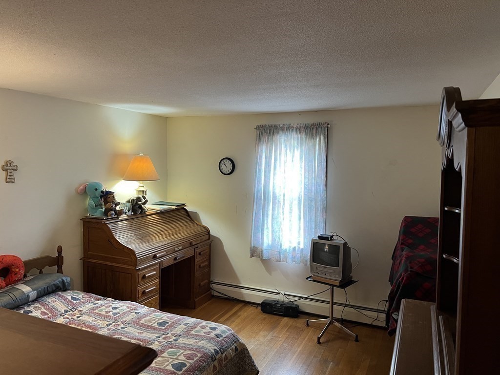 20 Meredith Road Forestdale, MA 02644 - Photo 12 of 19 a bedroom with a bed and a potted plant on the dresser