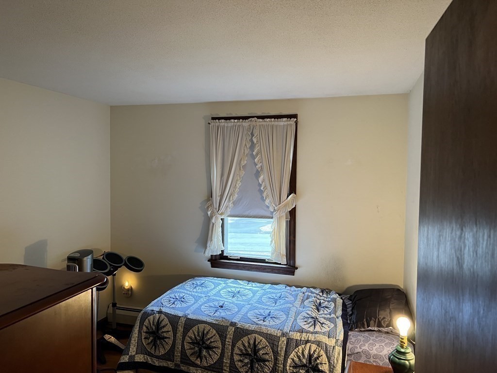 20 Meredith Road Forestdale, MA 02644 - Photo 15 of 19 a bedroom with a bed and wooden floor