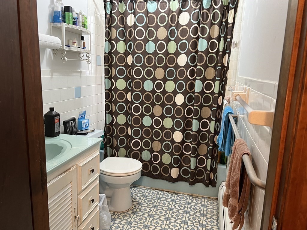 20 Meredith Road Forestdale, MA 02644 - Photo 16 of 19 a bathroom with a toilet and a shower curtain