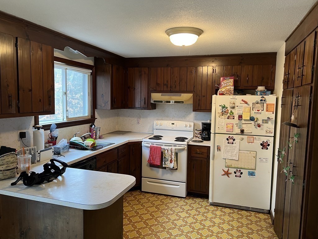20 Meredith Road Forestdale, MA 02644 - Photo 8 of 19 a kitchen with refrigerator and cabinets