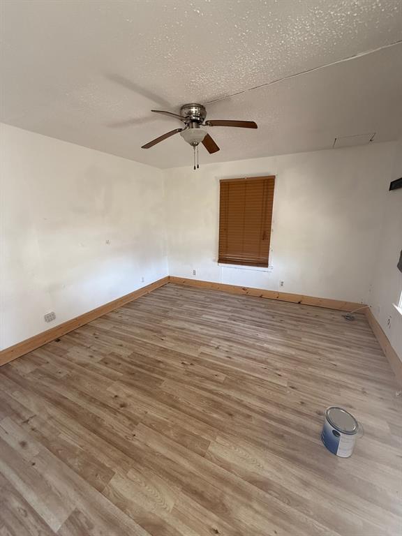 1711 Groesbeck Street Stephenville, TX 76401 - Photo 2 of 5 wooden floor in a room