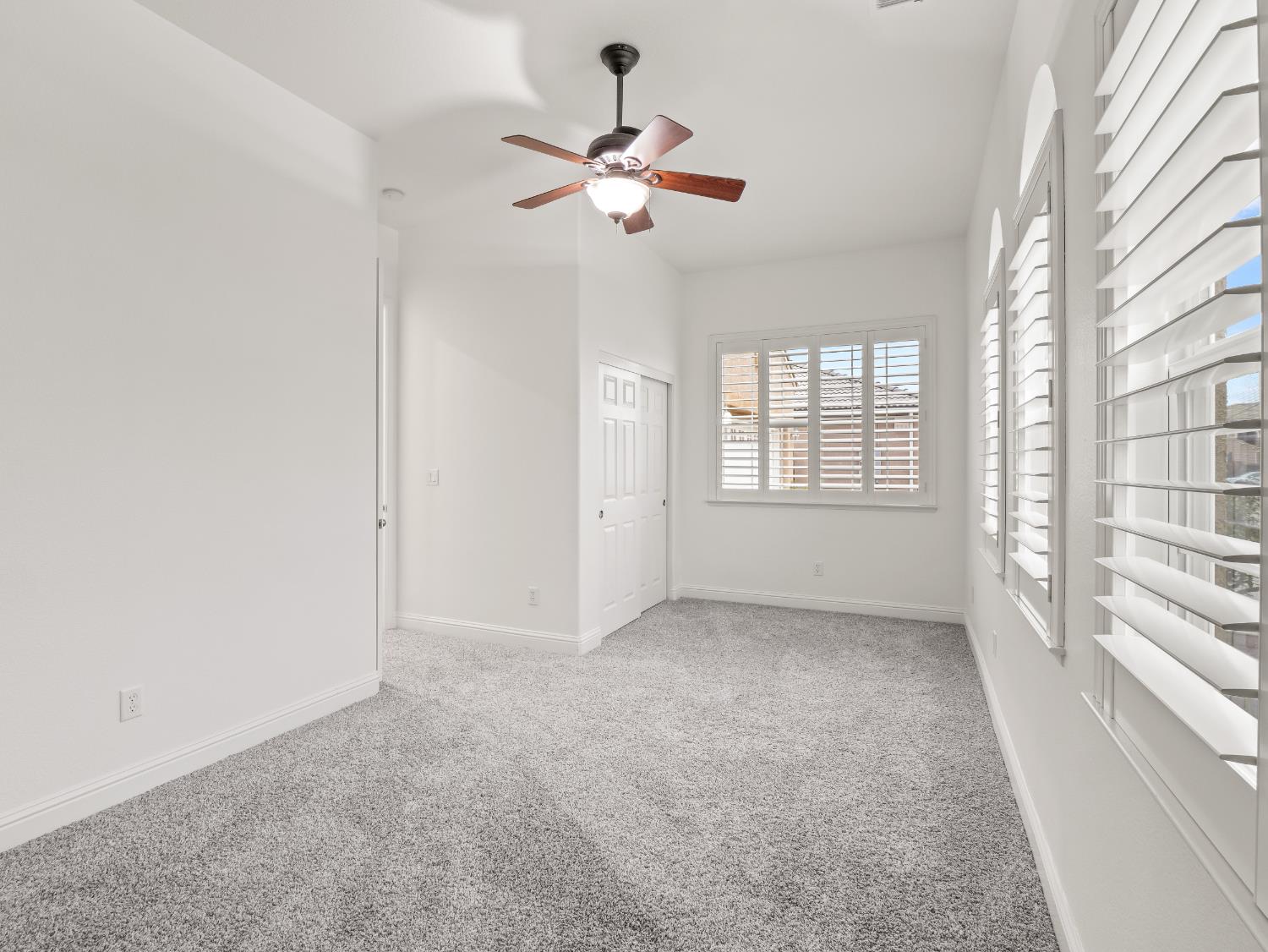 8683 North Richelle Avenue Fresno, CA 93720 - Photo 25 of 44 a view of an empty room with a window