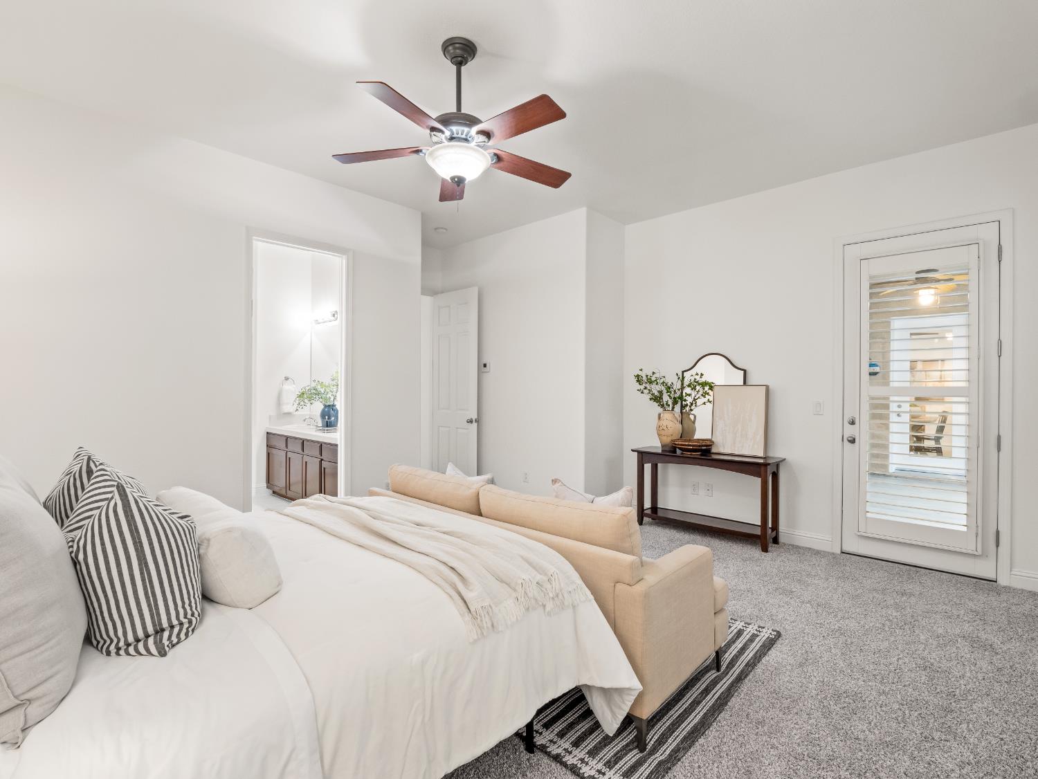 8683 North Richelle Avenue Fresno, CA 93720 - Photo 31 of 44 a bedroom with a bed and a chandelier