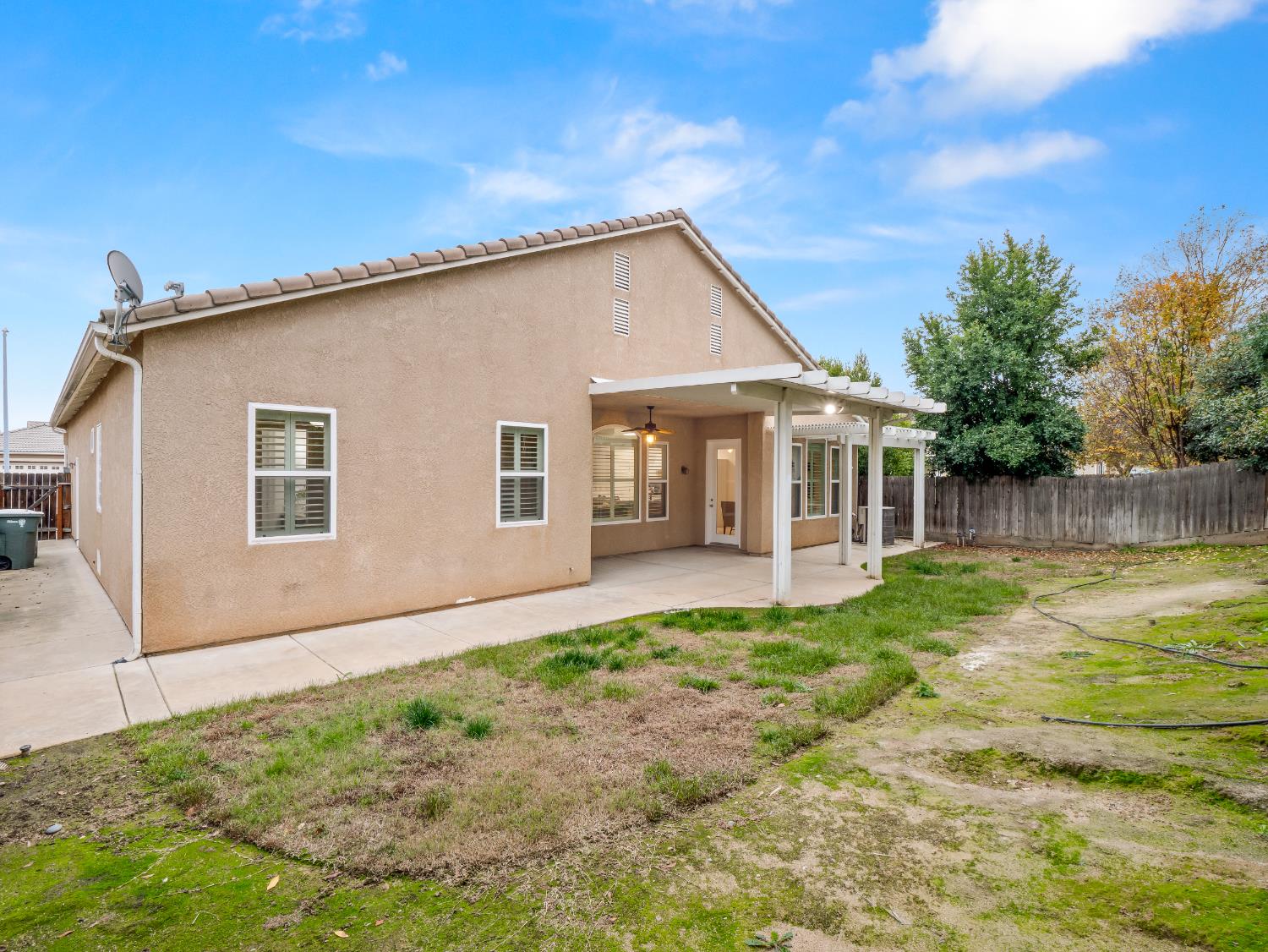 8683 North Richelle Avenue Fresno, CA 93720 - Photo 39 of 44 a view of a house with backyard and sitting area