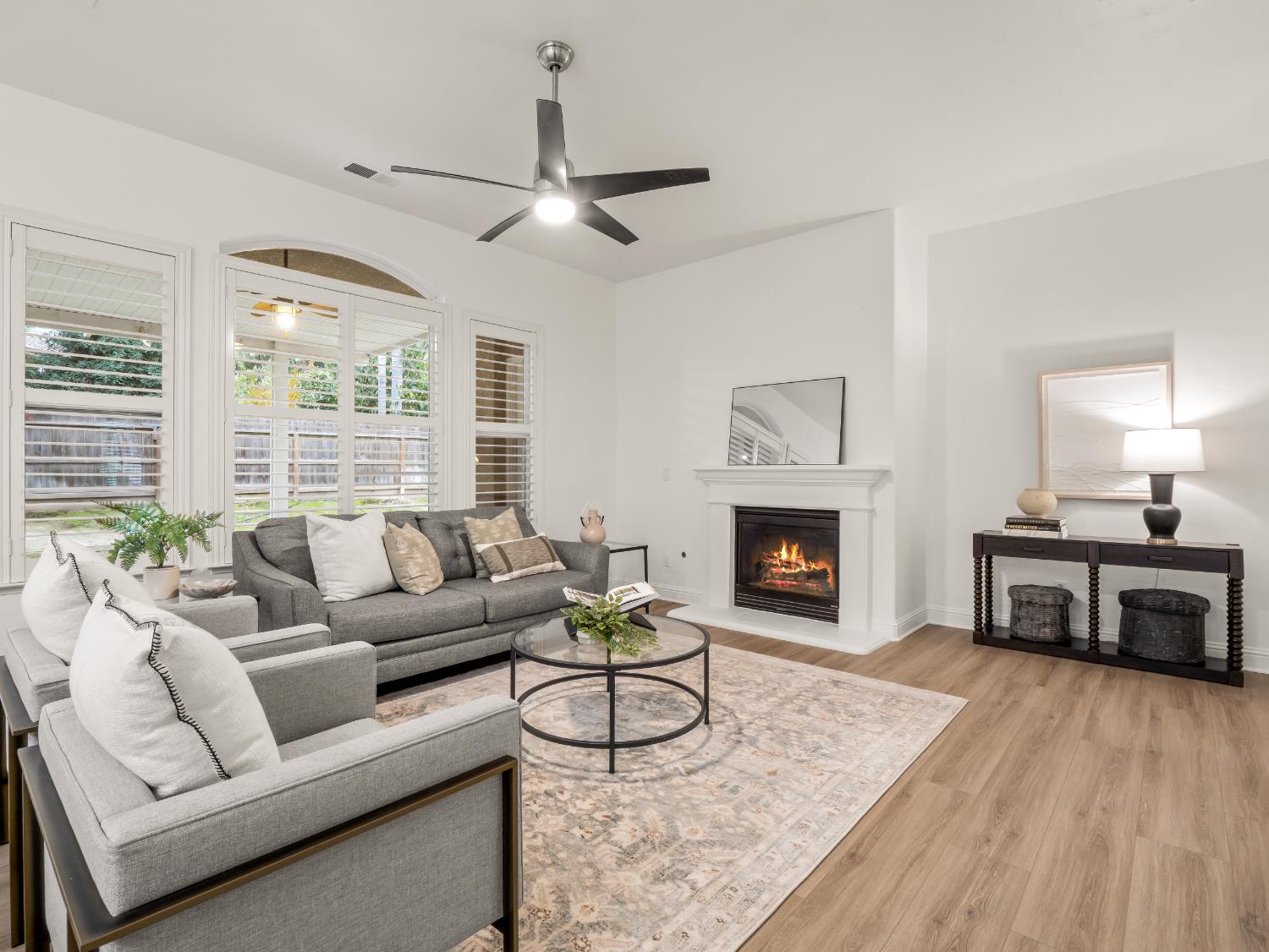 8683 North Richelle Avenue Fresno, CA 93720 - Photo 5 of 44 a living room with furniture and a fireplace