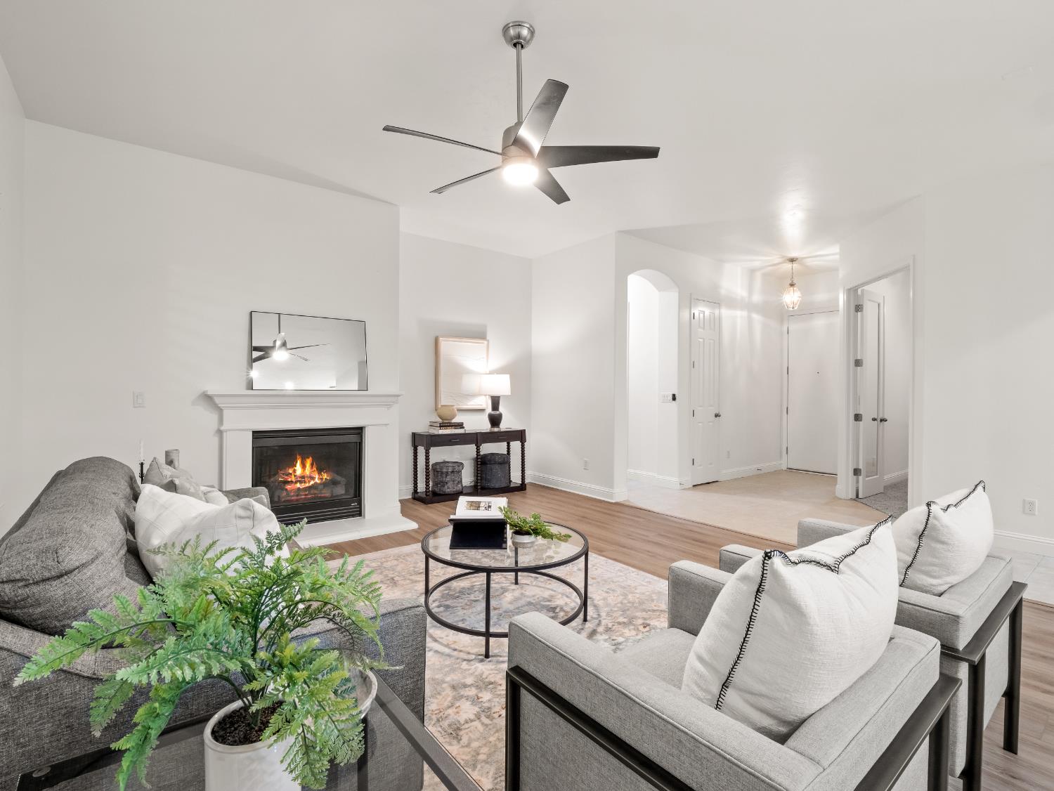 8683 North Richelle Avenue Fresno, CA 93720 - Photo 10 of 44 a living room with furniture and a fireplace
