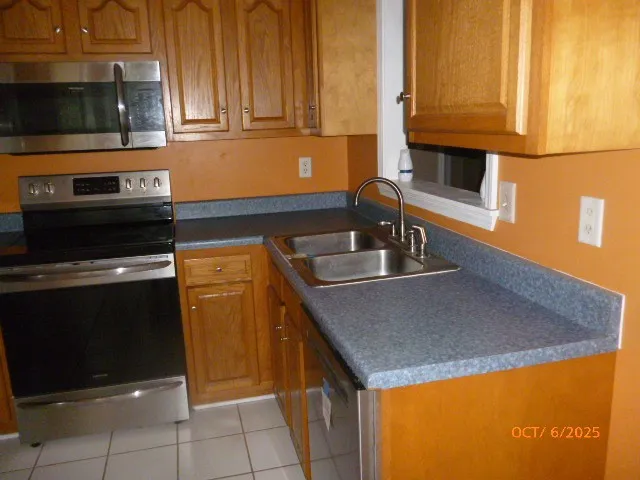 a kitchen with a sink and a microwave