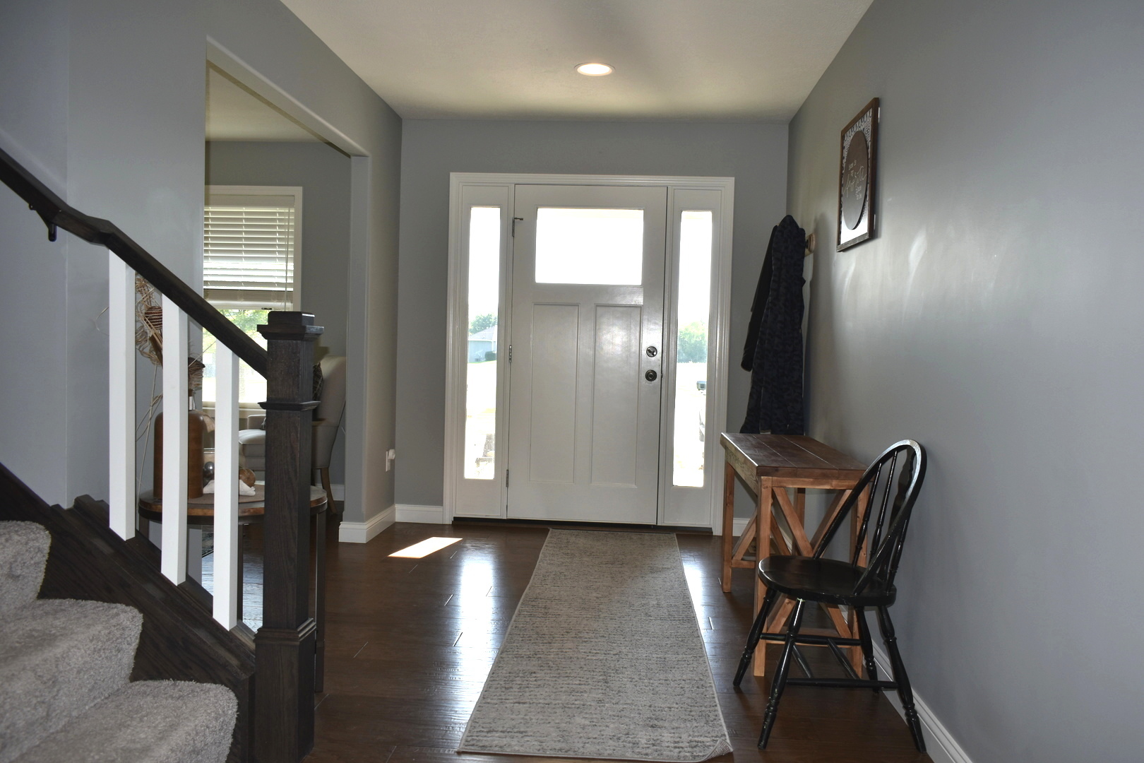 13 Wolf Run Road El Paso, IL 61738 - Photo 13 of 57 a view of a hallway with furniture and wooden floor