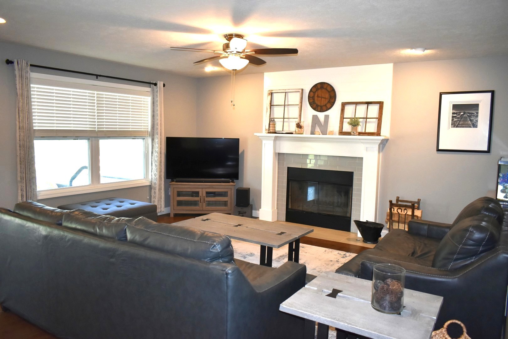 13 Wolf Run Road El Paso, IL 61738 - Photo 15 of 57 a living room with furniture a fireplace and a flat screen tv