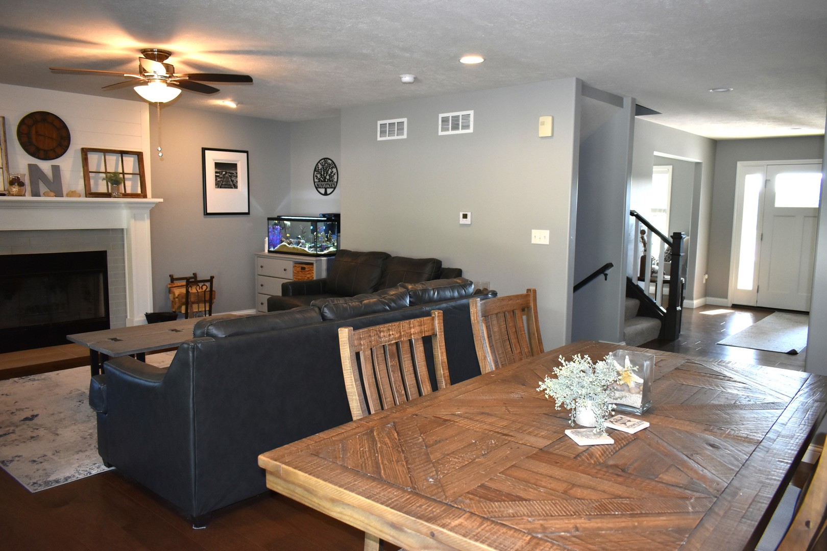 13 Wolf Run Road El Paso, IL 61738 - Photo 18 of 57 a living room with furniture a fireplace and a flat screen tv